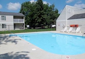 Clio apartment for rent - a large swimming pool in front of a house