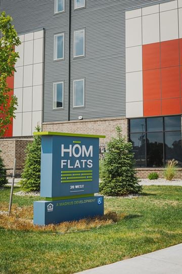 Wyoming apartment for rent - a home flats sign in front of a building
