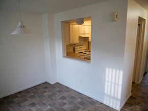 Midland townhouse for rent - A kitchen is visible through a window in a white room.