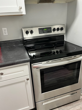 Clio apartment for rent - a kitchen with a stove and a oven in it
