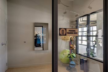 A room with a large window and a sculpture in the middle of it