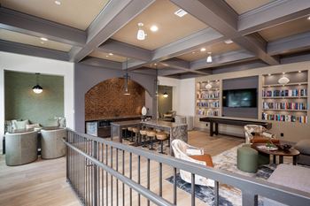 A clubhouse with a library and a pool table