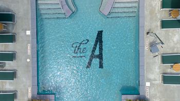 A swimming pool with the letter a in the water
