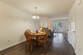 Augusta townhouse for rent - A dining room with a wooden table and chairs.