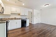 Augusta apartment for rent - A kitchen with white cabinets and a black oven at Helena Springs, Augusta, 30909