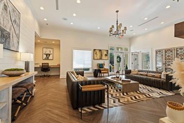 Augusta apartment for rent - A living room with a black couch and a wooden coffee table
