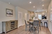 Warrenville townhouse for rent - a kitchen and dining room with a table and chairs at The Vista Apartments & Townhomes, Warrenville