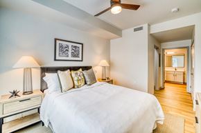 Westminster apartment for rent - A bedroom with a large bed and a ceiling fan.