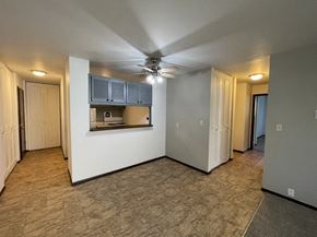 Milwaukee apartment for rent - an empty living room with a ceiling fan