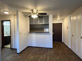 Milwaukee apartment for rent - a living room with a ceiling fan and a kitchen