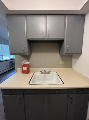 Milwaukee apartment for rent - an empty kitchen with a sink and cabinets