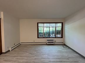 Milwaukee apartment for rent - the living room of an empty house with a large window