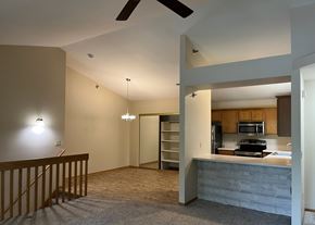 Waukesha apartment for rent - A modern kitchen with a ceiling fan and a countertop.