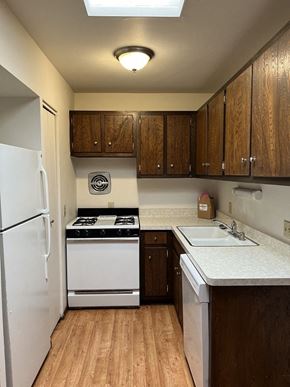 Milwaukee apartment for rent - a kitchen with a stove refrigerator and a sink