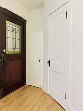 Milwaukee apartment for rent - a bedroom with a door and a wood floor