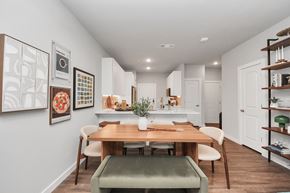 Spring apartment for rent - A dining room with a table and chairs.