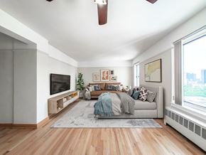 Chicago apartment for rent - a bedroom with a large bed and a large window