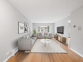 Chicago apartment for rent - a living room with two couches a coffee table and a tv