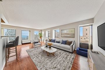Chicago apartment for rent - a living room with a couch and a table and a tv