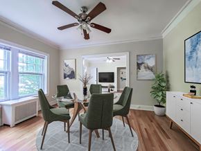 Chicago apartment for rent - a dining room with a table and chairs and a ceiling fan
