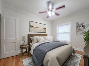 Chicago apartment for rent - a bedroom with a bed and a ceiling fan