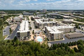 Des Peres apartment for rent - A large apartment community of buildings with a pool in the middle at Alinea Town and Country Luxury Apartments in Des Peres MO 63131..