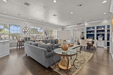 San Antonio apartment for rent - A living room with a grey couch and a glass coffee table.