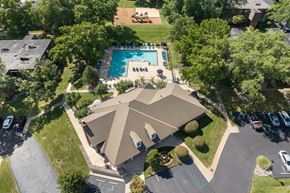 Ballwin apartment for rent - A bird's eye view of a house with a pool and trees.