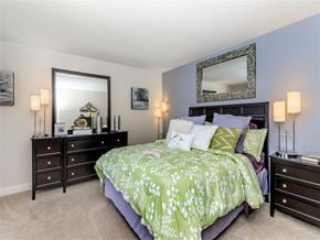 Manchester apartment for rent - a bedroom with a bed and two dressers