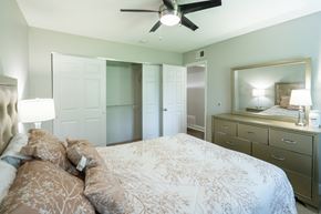 St. Louis apartment for rent - a bedroom with a large bed and a closet