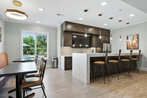 Weldon Springs apartment for rent - A modern kitchen with a dining table and chairs.