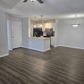 Evans apartment for rent - A kitchen with a white counter and a black stove top oven.