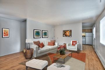 Fort Collins apartment for rent - A living room with a white couch and a coffee table.