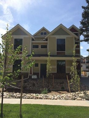 Fort Collins apartment for rent - a house with a lawn and trees in front of it