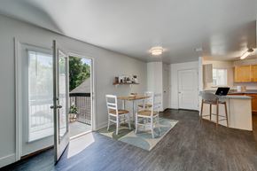 Fort Collins apartment for rent - A kitchen with a table and chairs is shown in the image.