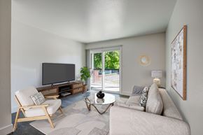 Fort Collins apartment for rent - A living room with a couch, chair, and television.