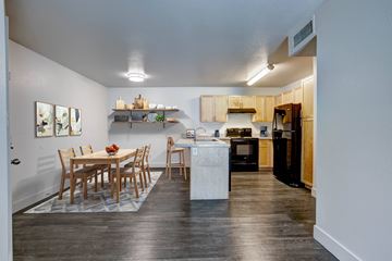 Fort Collins apartment for rent - A kitchen with a dining table and chairs.