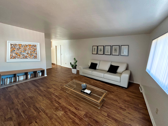 Fort Collins apartment for rent - A living room with a white couch and a coffee table.
