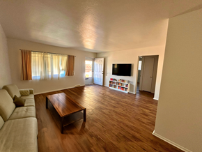 Fort Collins apartment for rent - A living room with a couch, a coffee table, and a bookshelf.