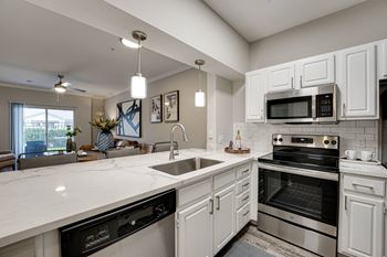 Kitchen with white cabinets and stainless steel appliances