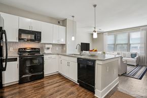 Cypress apartment for rent - Contemporary kitchen with peninsula and pendant lights at Highline Urban Lofts Apartments, Texas, 77429