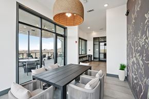 Grapevine apartment for rent - A modern dining room with a large table and chairs.