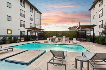 Pool and tables in front of a building