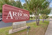 Cleburne apartment for rent - Property entrance monument sign with landscaping at Arbors Of Cleburne Apartments, Cleburne, TX