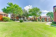 Arlington apartment for rent - A grassy area in front of a row of houses at Bardin Oaks Apartments, Arlington, Texas
