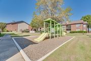 Arlington apartment for rent - Playground with a green slide at Bardin Oaks Apartments, Texas