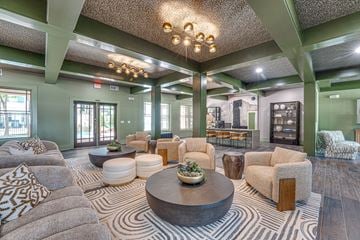 Dallas apartment for rent - A living room with a large coffee table and a variety of seating options.