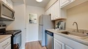 Bedford apartment for rent - A kitchen with a refrigerator, stove, and dishwasher at Copper Hill Apartments, Bedford