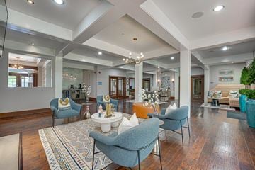 Dallas apartment for rent - A living room with a large rug and a sofa.