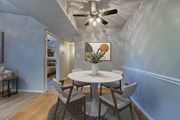 Carrollton apartment for rent - A dining room with a white table and chairs at Indian Creek Apartments, Carrollton, TX, 75007